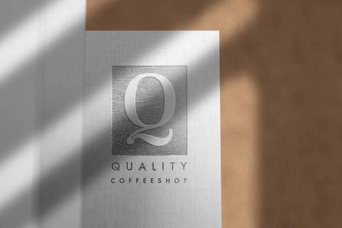 Debossed Silver Logo Mockup on Linen Paper